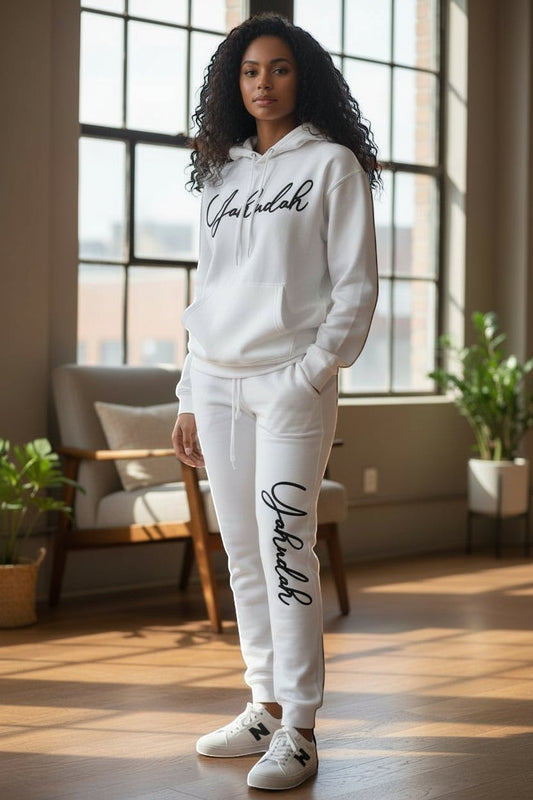 YAHUDAH COLLECTION white cotton tracksuit with flocked cursive logo on hoodie and pants.